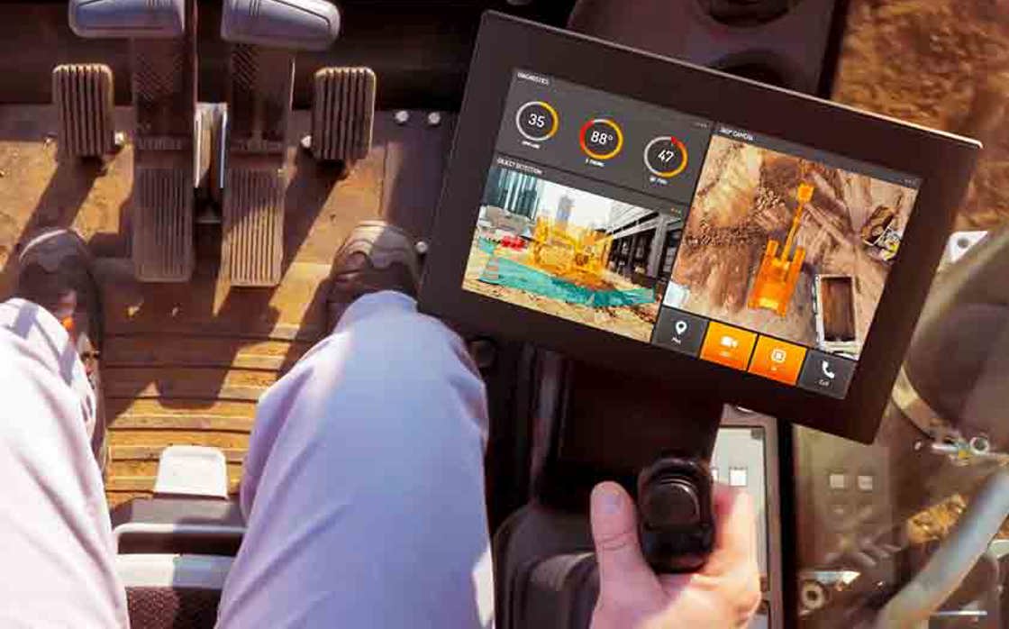 CCpilot V1000 in construction cabin with man driving.