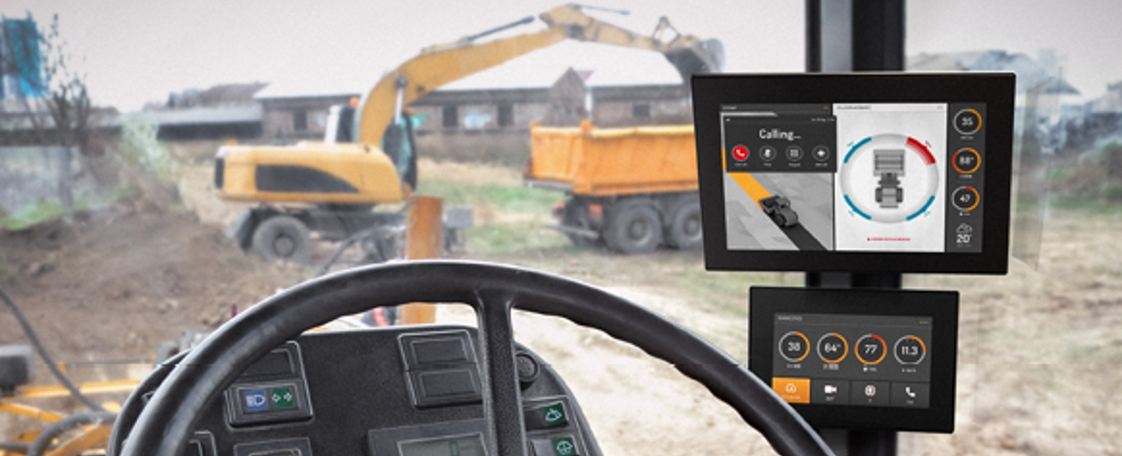 Tractor cabin with two display computers with construction GUI
