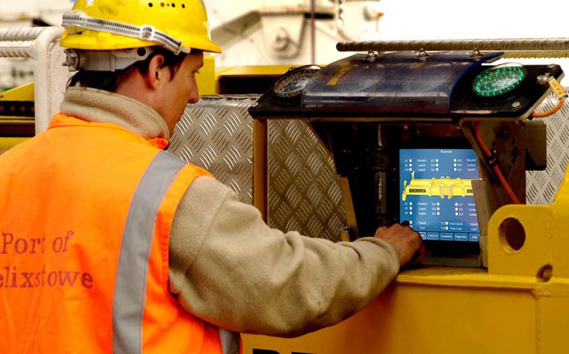 Engineer supporting material handling customer with their display computer HMI.