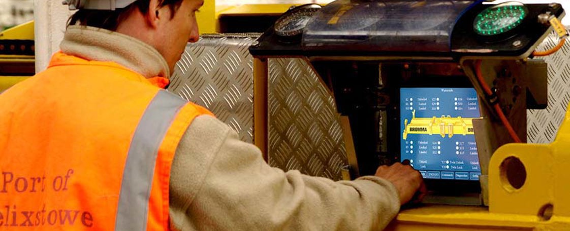 Engineer supporting material handling customer with their display computer HMI.
